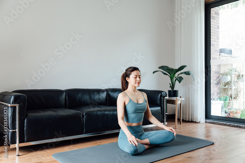 Photography young asian beauty woman doing yoga at home