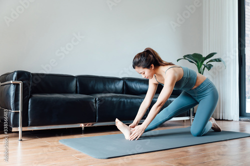 young asian beauty woman doing yoga at home