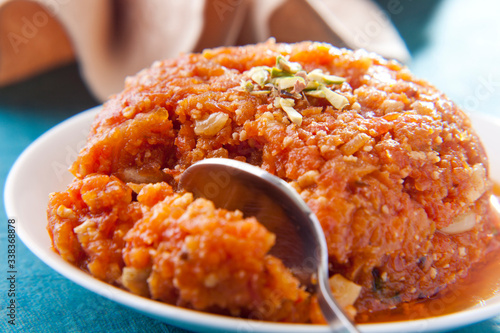 Gajar ka halwa in a bowl , indian sweets
 photo