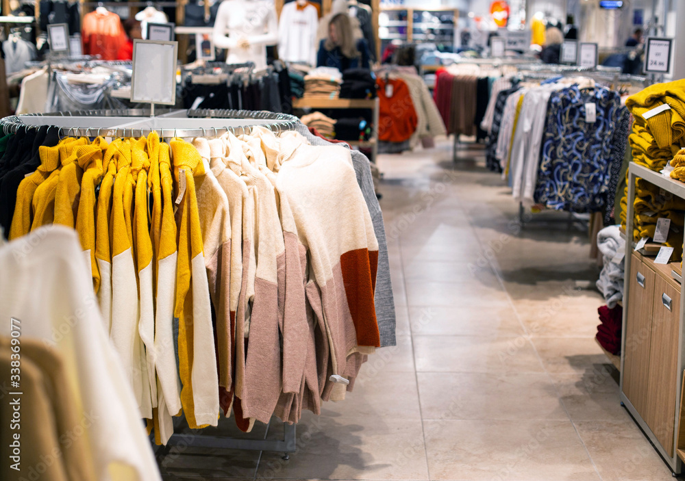 Selling and buying warm items in store for the autumn and winter season. Fashionable and stylish jackets and sweaters are sold in the store, fashionable Selling and buying warm items in store for the autumn and winter season. Fashionable and stylish jackets and sweaters are sold in the store, fashionable