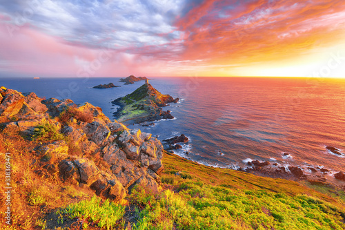 Torra di a Parata with Genoese Tower and Archipelago of Sanguinaires islands at background.