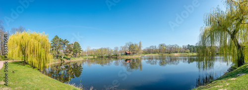 Panoramic cityscape of a small pond in the central city park in downtown of Magdeburg at early Spring, Germany