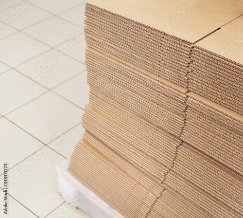 A stack of sheets of industrial packaging board. Cardboard Sheets for Boxes, copy space, industrial, carton photo