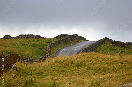 Hilly road rising above the fields in Yorkshire