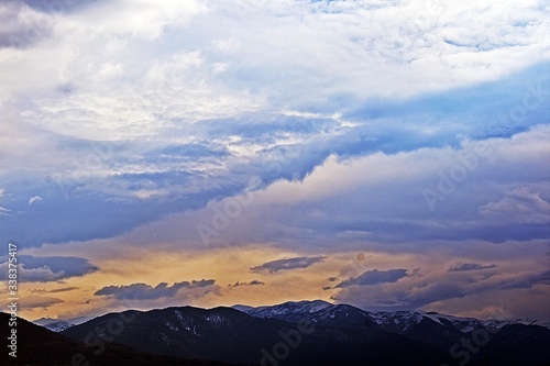 clouds over the mountains © diego_hz