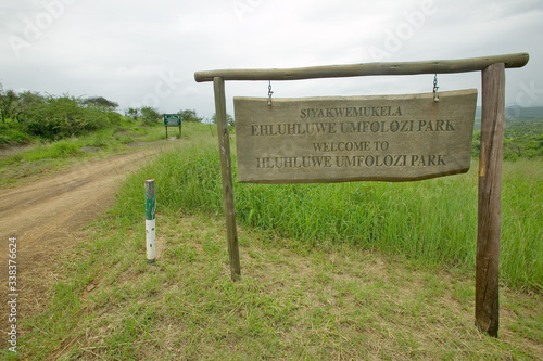 Sign reads Welcome to Hluhluwe Umfolozi Park, South Africa photo
