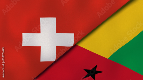 The flags of Switzerland and Guinea Bissau. News, reportage, business background. 3d illustration photo