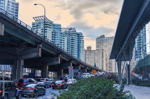 Car traffic jam at the entrance of a freeway in downtown Toronto. City and transport concept. Toronto, Ontario, Canada