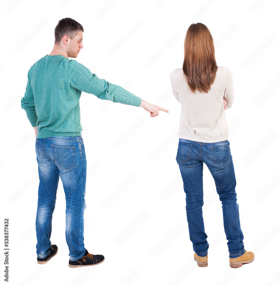 Back view of couple in sweater pointing. Back view of couple in sweater pointing.
