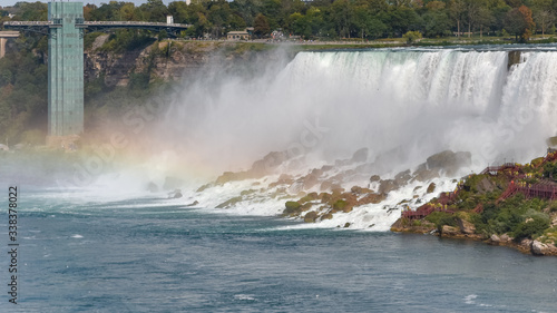 Panorama of the American side of the falls  with rainbow. Concept of travel and tourism. Niagara Falls  Canada. United States