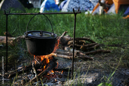 tourist cauldron over a campfire