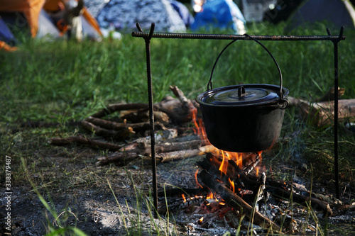 tourist cauldron over a campfire