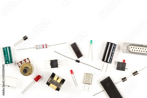 Bilde på lerret Different electronic parts or components on white with resistors, capacitors, di