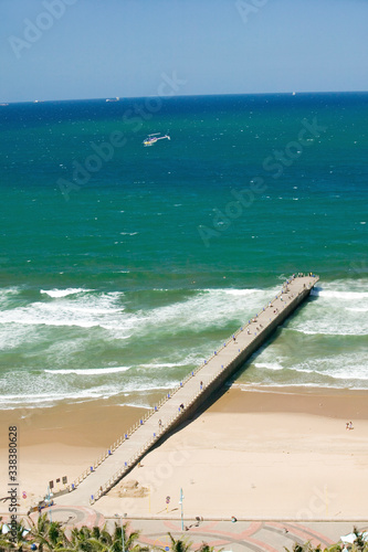 Aerial view of Indian Ocean, white sandy beaches and ocean pier in the town center of Durban, South Africa