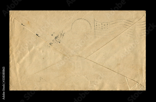 Old postage envelope on a black background, message, air mail