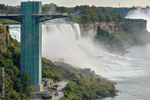 Close up of the observatory on the American side full of tourists and the waterfall in the background. Concept of travel and tourism. Niagara Falls  Canada United States