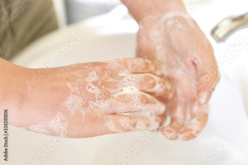 Washing Hands in Basin with Bubble Soap to prevent the spread of Covid 19   Corona Virus