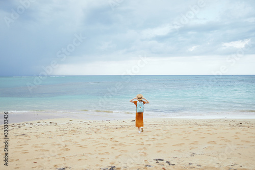 young woman running on the beach