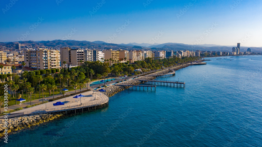 Cyprus. Limassol. Wooden embankment. Panorama of the Cyprus coast. Resorts of the Mediterranean Sea. Summer vacation in Limassol. Embankment against the blue sky. Beaches of Cyprus. Island Cruises