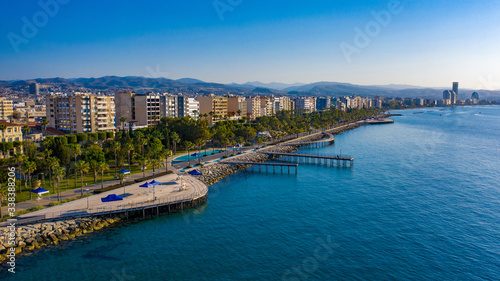 Cyprus. Limassol. Wooden embankment. Panorama of the Cyprus coast. Resorts of the Mediterranean Sea. Summer vacation in Limassol. Embankment against the blue sky. Beaches of Cyprus. Island Cruises photo