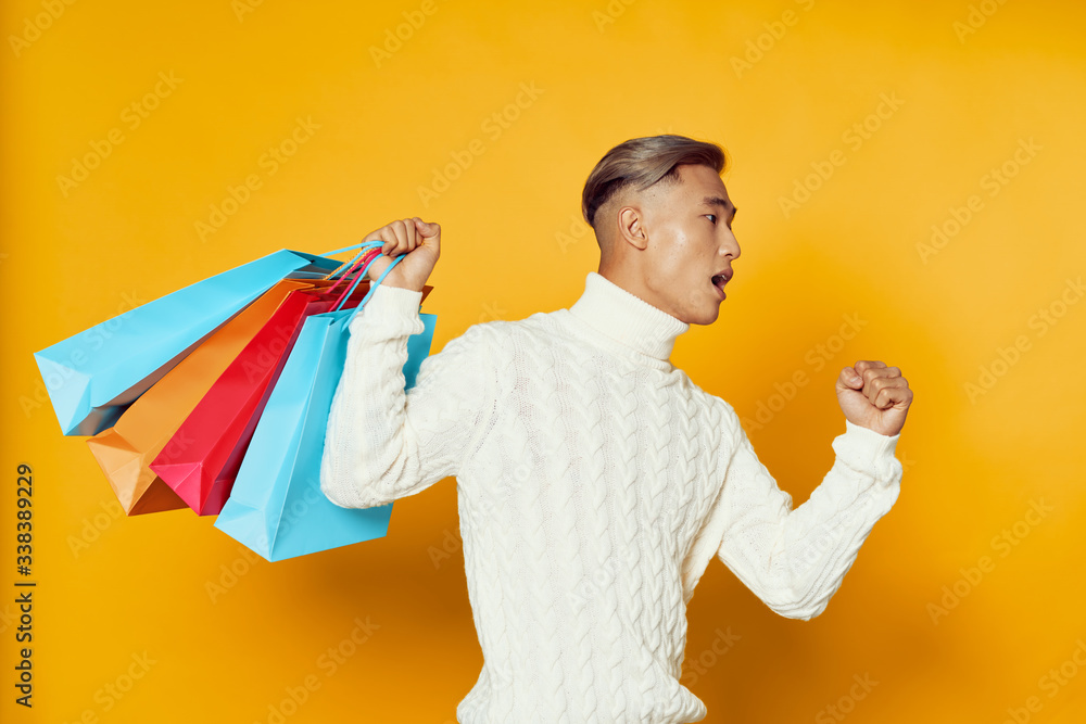 young man with shopping bags young man with shopping bags