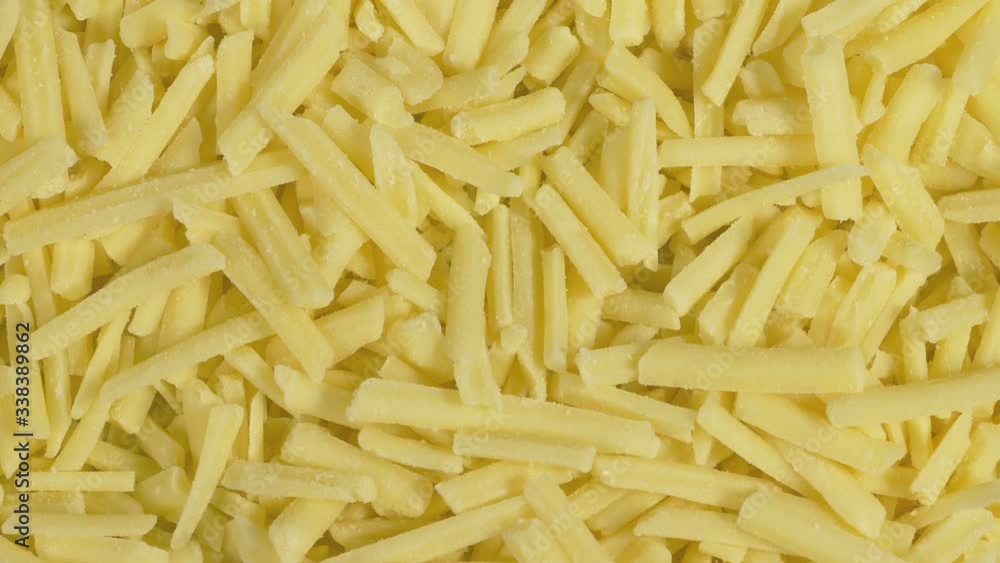 Extreme Closeup Of Grated Cheddar Cheese On Plate Extreme Closeup Of Grated Cheddar Cheese On Plate