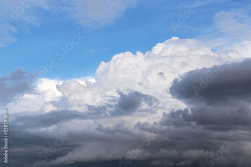 Epic dramatic Storm sky, dark and white big cumulus clouds on blue sky background texture  © Viktor Iden