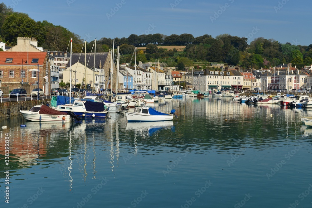 St Aubin's harbor, Jersey, U.K. 19th pretty port in Spring with a high tide.
