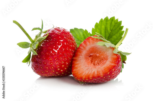 strawberries, whole one another half, isolated on white backgraund