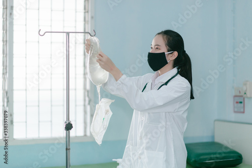 a female doctor showing how to dialysis