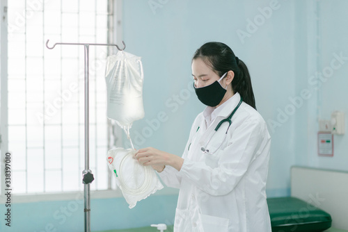 a female doctor showing how to dialysis