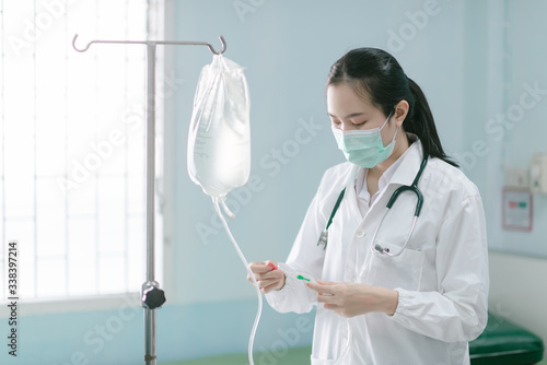 a female doctor showing how to dialysis