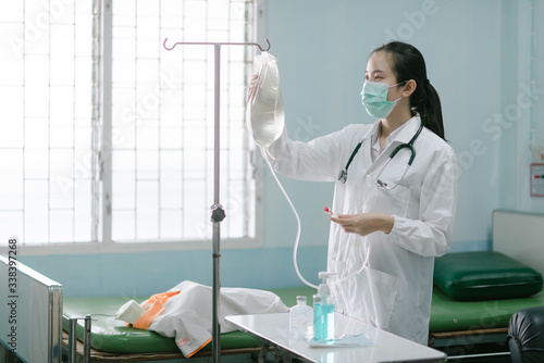 a female doctor showing how to dialysis