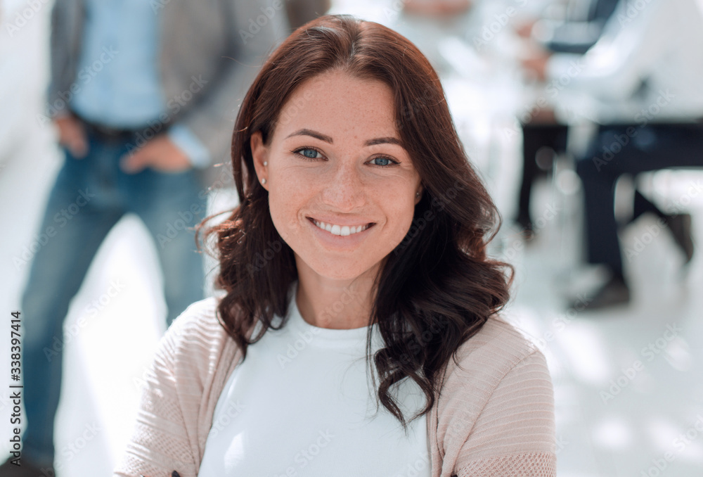 portrait of a young business woman on the background of the offi portrait of a young business woman on the background of the offi