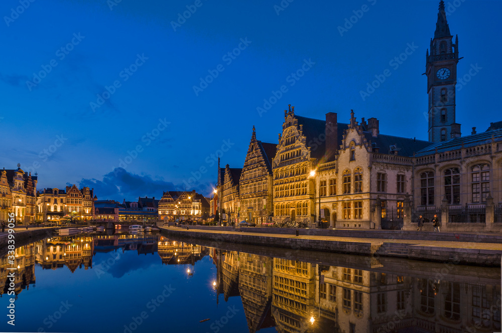 Panoramic view on the Façades of the Graslei by night in Ghent, Belgium