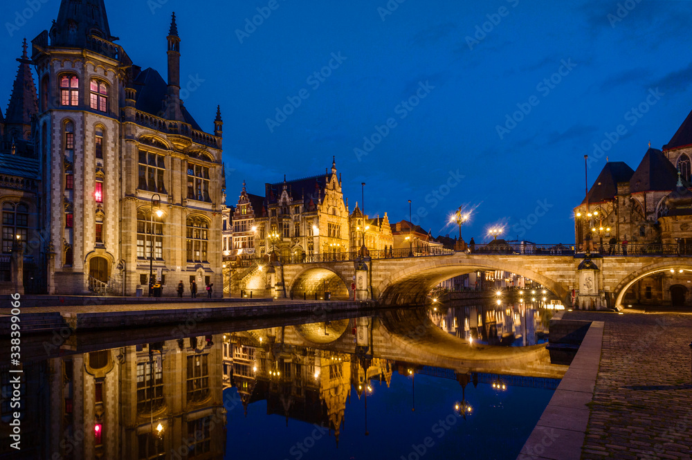 Ghent, Flemish Region / Belgium - april 24 2012 : St Michael’s Bridge and old post office at night in Ghent, Belgium