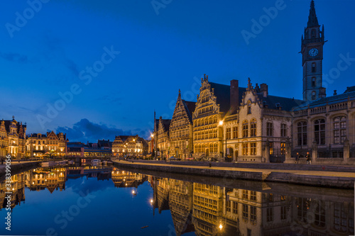 Panoramic view on the Façades of the Graslei by night in Ghent, Belgium