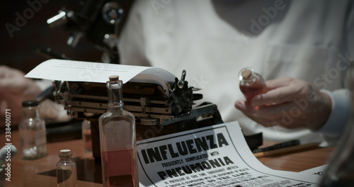 Fotografie Notice of the Spanish Flu influenza epidemic of the year 1918 lying on the laboratory table of a doctor studying the virus