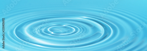 Waves on the surface of the water from a collision. Drop of water drop to the surface.