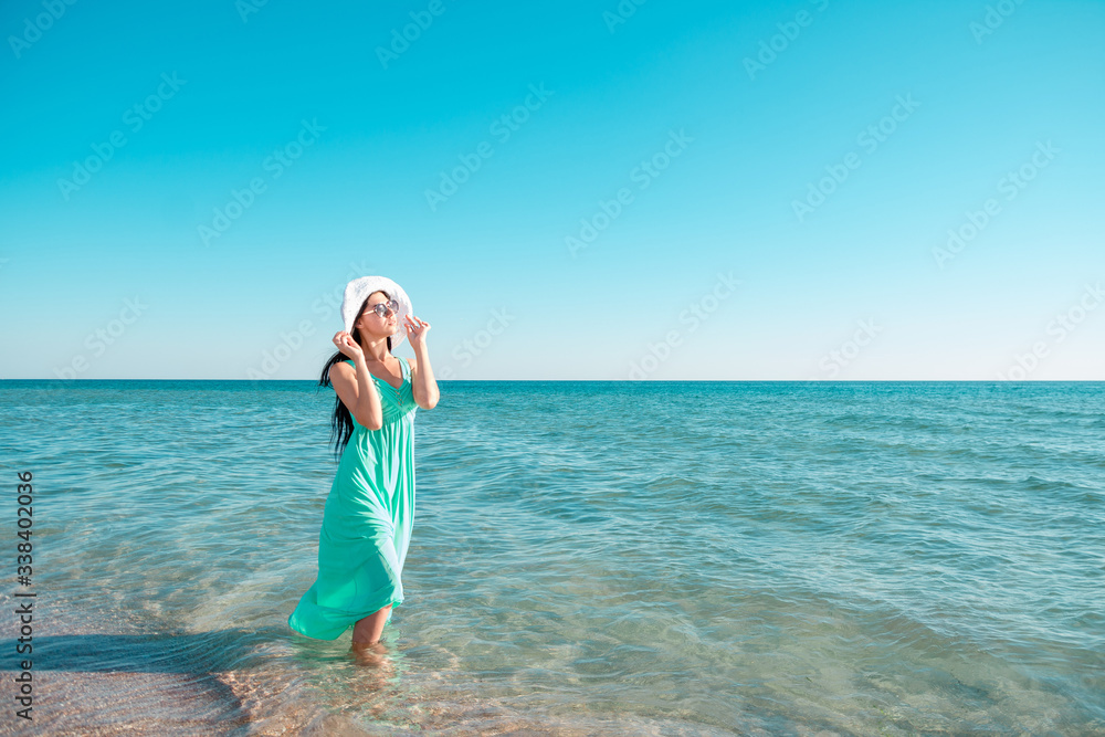 Beautiful woman on the beach. Single girl in long dress. Beautiful woman on the beach. Single girl in long dress.
