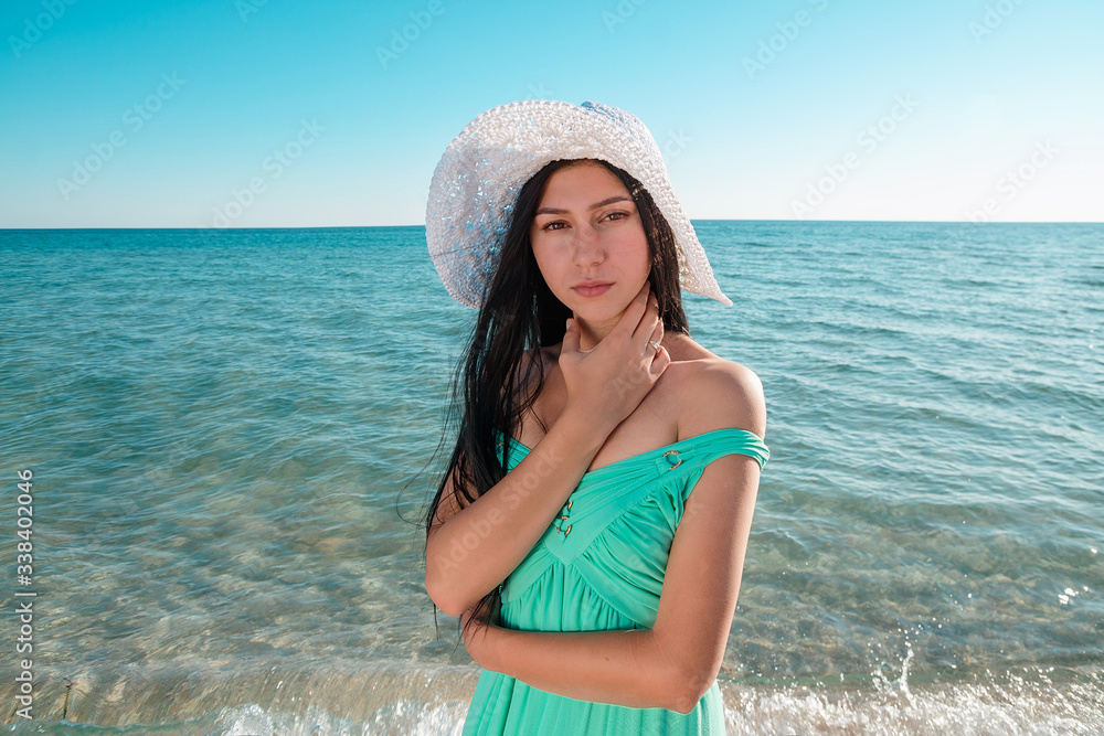 Beautiful woman on the beach. Single girl in long dress. Beautiful woman on the beach. Single girl in long dress.
