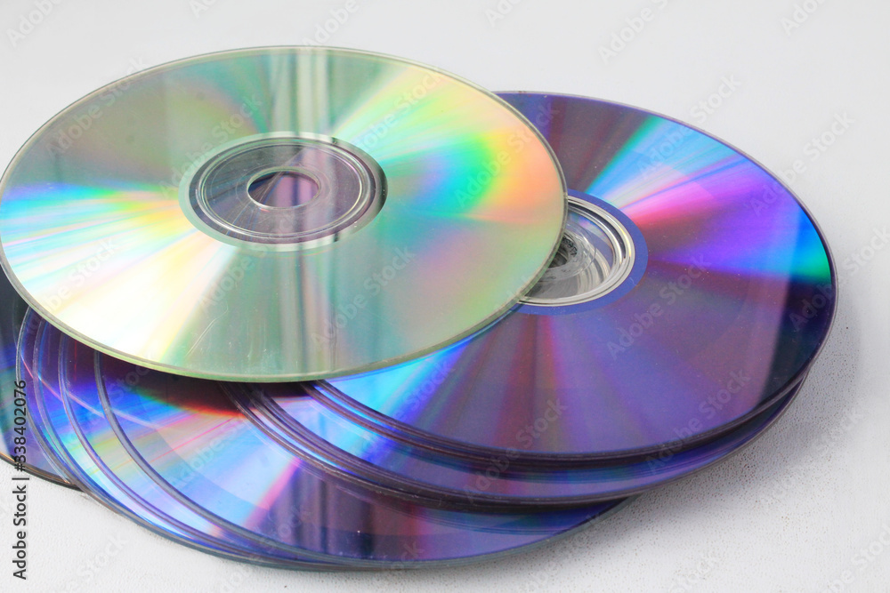 Old used computer disks on a white background. Old used computer disks on a white background.