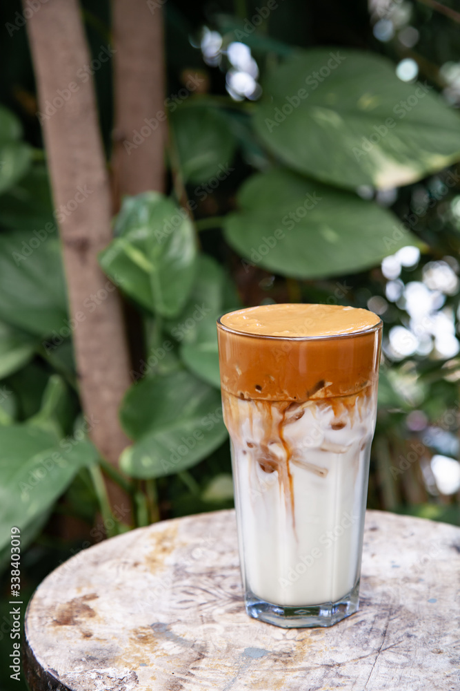Iced Dalgona Coffee, a trendy fluffy creamy whipped coffee Iced Dalgona Coffee, a trendy fluffy creamy whipped coffee
