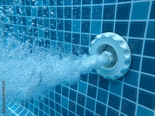 Fotografi Air bubbles from jacuzzi jet in thermal spa swimming pool