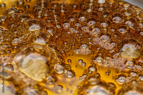 boiling sugar with bubbles turns into caramel, caramelization photo