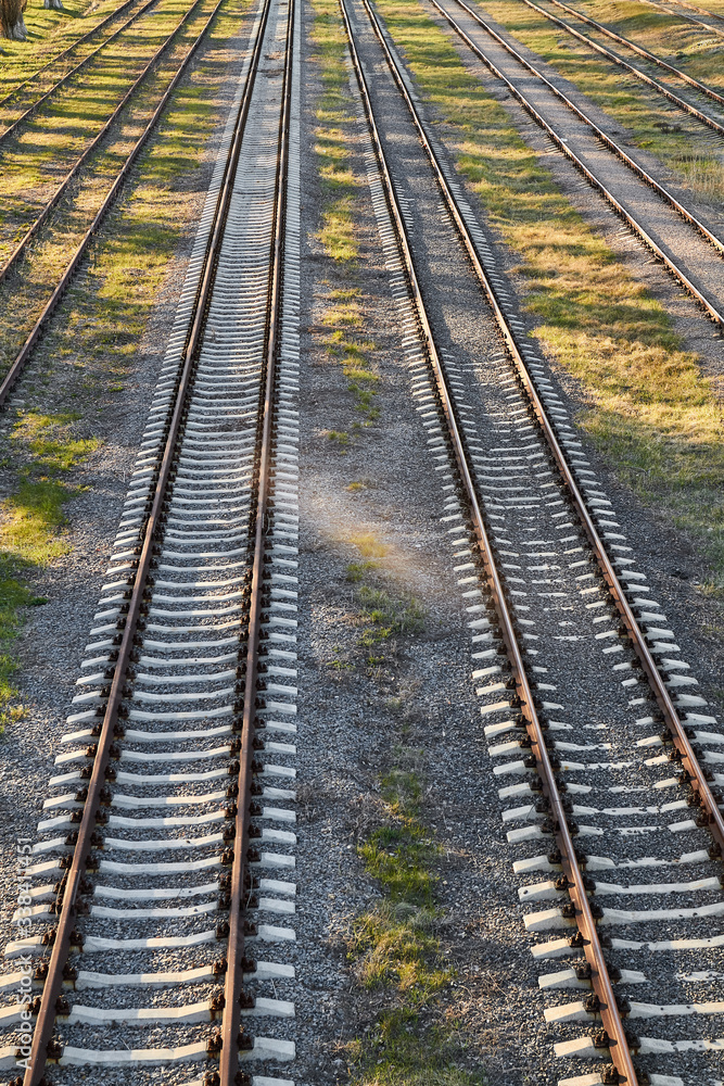 Fototapeta premium Rusty railroad tracks on gravel. Top view.