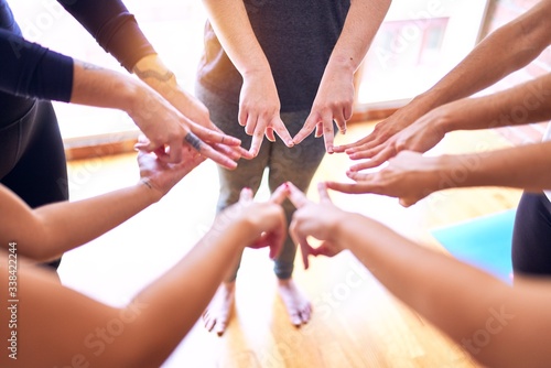 Young beautiful sportwomen doing gesture with hands