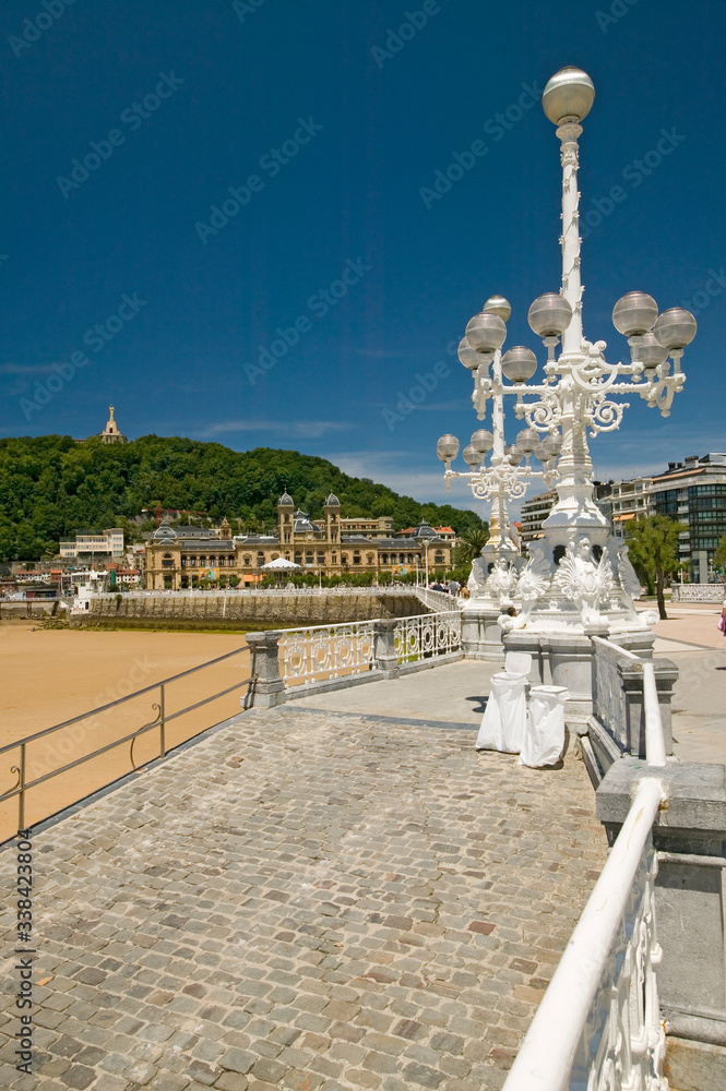 Old street lights are seen on Paseo del Muelle, a walkway along the harbor of Playa de La Concha, in Donostia-San Sebastian, Basque region of Spain, the Queen of Euskadi's and Cantabrian Coast