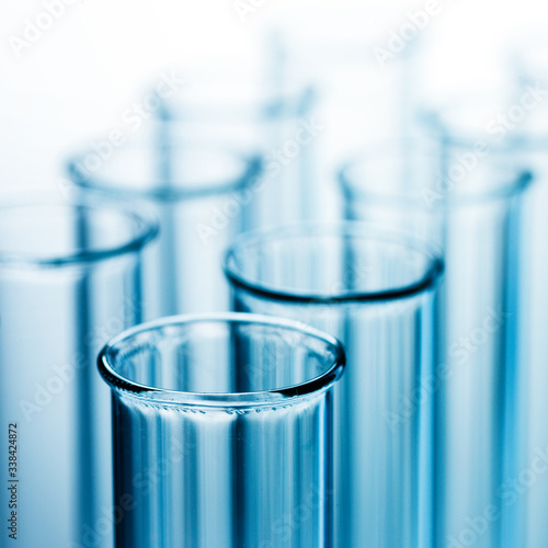 Different laboratory glassware with liquid and with reflection