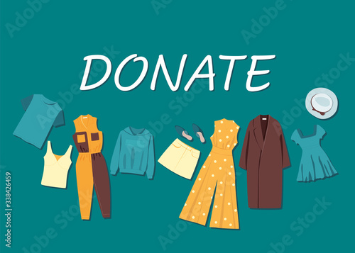 Different clothes on a green background. Clothing donation